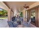 Relaxing covered patio area, complete with comfortable seating and ceiling fans for enjoying the outdoors at 4440 W Fallen Leaf Ln, Glendale, AZ 85310