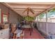 A covered back porch with ceiling fans, outdoor furniture and lots of room for entertaining at 4512 E Turney Ave, Phoenix, AZ 85018