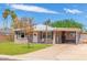 Lovely single-story home with a manicured front lawn and covered carport at 4512 E Turney Ave, Phoenix, AZ 85018