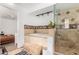 Tiled bathroom with soaking tub, frameless shower, and granite surround at 4705 W Annette Cir, Glendale, AZ 85308