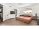 Comfortable bedroom with neutral tones, ceiling fan, and natural light that promotes restful sleep and relaxation at 4705 W Annette Cir, Glendale, AZ 85308