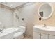 Bathroom featuring a tub, vanity, tile surround, and shower at 5307 E Cambridge Ave, Phoenix, AZ 85008