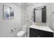 Stylish powder bathroom featuring a vanity with gold hardware, designer mirror, and modern tiling at 5340 S Sabrina --, Mesa, AZ 85212