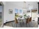 Elegant dining room boasts ample natural light and a modern chandelier above the dining table at 5340 S Sabrina --, Mesa, AZ 85212