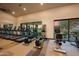 Well-equipped gym featuring treadmills, stationary bikes, and elliptical machines with neighborhood views at 5340 S Sabrina --, Mesa, AZ 85212