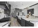 Spacious kitchen featuring a large island, marble countertops, and gray cabinetry with gold hardware at 5340 S Sabrina --, Mesa, AZ 85212