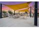 Outdoor kitchen beneath awning with built-in grill, counter space, and picnic table seating at 5340 S Sabrina --, Mesa, AZ 85212