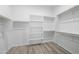 Functional walk-in closet with shelving and hanging rods providing efficient storage solutions at 5340 S Sabrina --, Mesa, AZ 85212