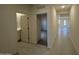 Hallway view showcasing tiled floors leading to bedrooms and bathroom, with an open view into the living area at 6078 E Artemis Dr, Florence, AZ 85132