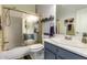 This bathroom features a shower and tub combination with a gold frame and a sleek vanity with counter space at 6531 E Star Valley St, Mesa, AZ 85215