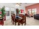 Formal dining room with a ceiling fan, neutral carpet, and lots of natural light at 6531 E Star Valley St, Mesa, AZ 85215