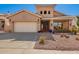 Charming home featuring desert landscaping, tile roof, and an attached two-car garage at 6531 E Star Valley St, Mesa, AZ 85215