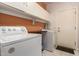 Efficient laundry room with washer, dryer, and ample storage space at 6531 E Star Valley St, Mesa, AZ 85215