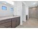 Elegant bathroom with double vanity, stone countertop, and glass-enclosed shower at 6735 N 9Th Dr, Phoenix, AZ 85013