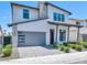 Beautiful two-story home showcasing a gray garage door, and low maintenance landscaping at 6735 N 9Th Dr, Phoenix, AZ 85013