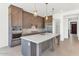 Modern kitchen features sleek cabinets, stainless steel appliances, and a large center island at 6735 N 9Th Dr, Phoenix, AZ 85013