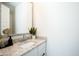 Stylish bathroom vanity with granite countertop, modern faucet, and decorative plant at 741 N Abalone Ct, Gilbert, AZ 85233