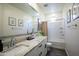 Well-lit bathroom featuring a granite-topped vanity and a tub with shower at 741 N Abalone Ct, Gilbert, AZ 85233