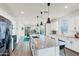 Bright kitchen with stainless steel appliances, large island, and an adjacent dining area at 741 N Abalone Ct, Gilbert, AZ 85233