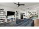 Open-concept living room with a view into the kitchen, modern furniture, and stylish decor at 741 N Abalone Ct, Gilbert, AZ 85233