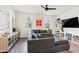 Cozy living room featuring a large sectional sofa, modern decor, and bright natural light at 741 N Abalone Ct, Gilbert, AZ 85233