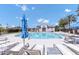 Community pool featuring many lounge chairs with bright blue skies for sunny relaxation at 741 N Abalone Ct, Gilbert, AZ 85233