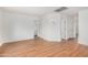 A bedroom with hardwood floors and neutral paint leads to an adjacent bathroom at 7413 N 67Th Dr, Glendale, AZ 85303