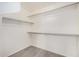 Walk in closet with wood floors and shelving at 7413 N 67Th Dr, Glendale, AZ 85303