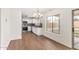 Bright kitchen featuring stainless steel appliances, white cabinets, and tiled backsplash at 7413 N 67Th Dr, Glendale, AZ 85303