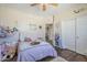 Cozy bedroom featuring a comfortable bed, playful decor, and ample natural light at 7421 S 25Th Ln, Phoenix, AZ 85041