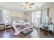 Cozy bedroom with a ceiling fan, lots of natural light, and hardwood floors at 7421 S 25Th Ln, Phoenix, AZ 85041