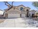 Expansive desert home featuring a 3-car garage, arched windows, neutral stucco and manicured landscaping at 7421 S 25Th Ln, Phoenix, AZ 85041