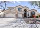 Expansive desert home featuring a 3-car garage, arched windows, neutral stucco and manicured landscaping at 7421 S 25Th Ln, Phoenix, AZ 85041