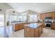 Large kitchen with stainless steel appliances, granite counters, and large island at 7421 S 25Th Ln, Phoenix, AZ 85041