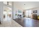 Open living space featuring neutral tones, a desk, and large windows at 7421 S 25Th Ln, Phoenix, AZ 85041