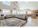 Large living room showcases seamless flow between living, dining, and kitchen areas at 7421 S 25Th Ln, Phoenix, AZ 85041