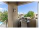 Balcony view featuring a stainless steel gas grill and a charming outdoor lantern at 7675 E Mcdonald Dr # 225, Scottsdale, AZ 85250