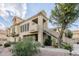 Charming two-story home featuring desert landscaping, stairway and appealing architectural details at 7675 E Mcdonald Dr # 225, Scottsdale, AZ 85250