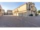 Building with individual garage doors and a brick-paved driveway at 7675 E Mcdonald Dr # 225, Scottsdale, AZ 85250