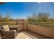 Relaxing balcony with comfortable seating, offering a serene outdoor space with neighborhood views at 7693 E Via Del Sol Dr, Scottsdale, AZ 85255