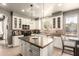 Bright kitchen with white cabinets, dark countertops, and a center island at 7693 E Via Del Sol Dr, Scottsdale, AZ 85255