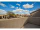 Scenic view of a vibrant neighborhood with well-maintained homes under a beautiful cloudy sky at 7693 E Via Del Sol Dr, Scottsdale, AZ 85255