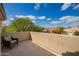 Private outdoor patio with textured walls and neutral toned furniture at 7693 E Via Del Sol Dr, Scottsdale, AZ 85255