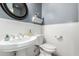 Stylish powder room with a pedestal sink and elegant decor at 7693 E Via Del Sol Dr, Scottsdale, AZ 85255