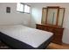 Bedroom with a plush mattress and traditional wooden dresser with mirror at 7807 E Main St # B-19, Mesa, AZ 85207