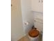 Toilet room featuring a wood-topped toilet and built-in cabinetry above at 7807 E Main St # B-19, Mesa, AZ 85207