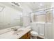 Bright bathroom featuring a sink with vanity, toilet, and walk-in shower and tub combination at 825 N Sierra Vista Dr, Wickenburg, AZ 85390