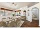 Bright and airy dining room with wood floors, neutral furniture, and a sliding glass door at 825 N Sierra Vista Dr, Wickenburg, AZ 85390