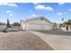 Spacious home with a three-car garage and brick driveway; perfect for parking multiple vehicles at 825 N Sierra Vista Dr, Wickenburg, AZ 85390