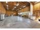 Interior view of the garage, showcasing ample space, storage, and workshop area with pegboard at 825 N Sierra Vista Dr, Wickenburg, AZ 85390